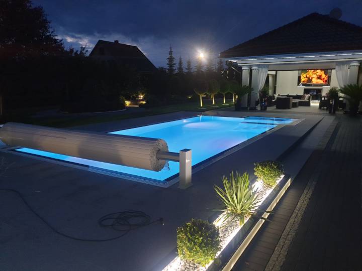 Luxury outdoor swimming pool with LED lighting and roller blind Luxury outdoor swimming pool with LED lighting and roller blind