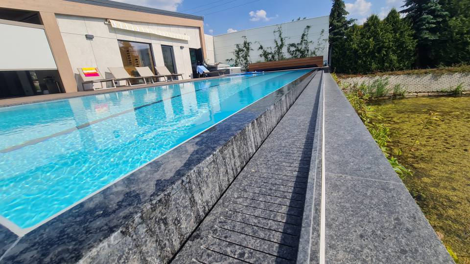 Luxury swimming pool infinity edge. Natural stone finish. Luxury swimming pool infinity edge. Natural stone finish.