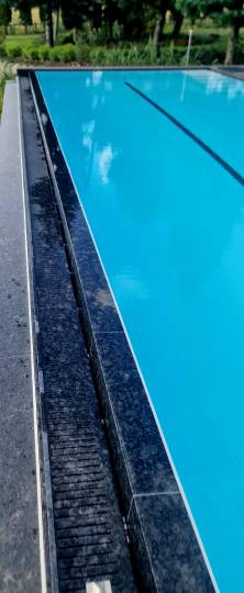 Designer swimming pool with natural stone , infinity edge. Designer swimming pool with natural stone , infinity edge.